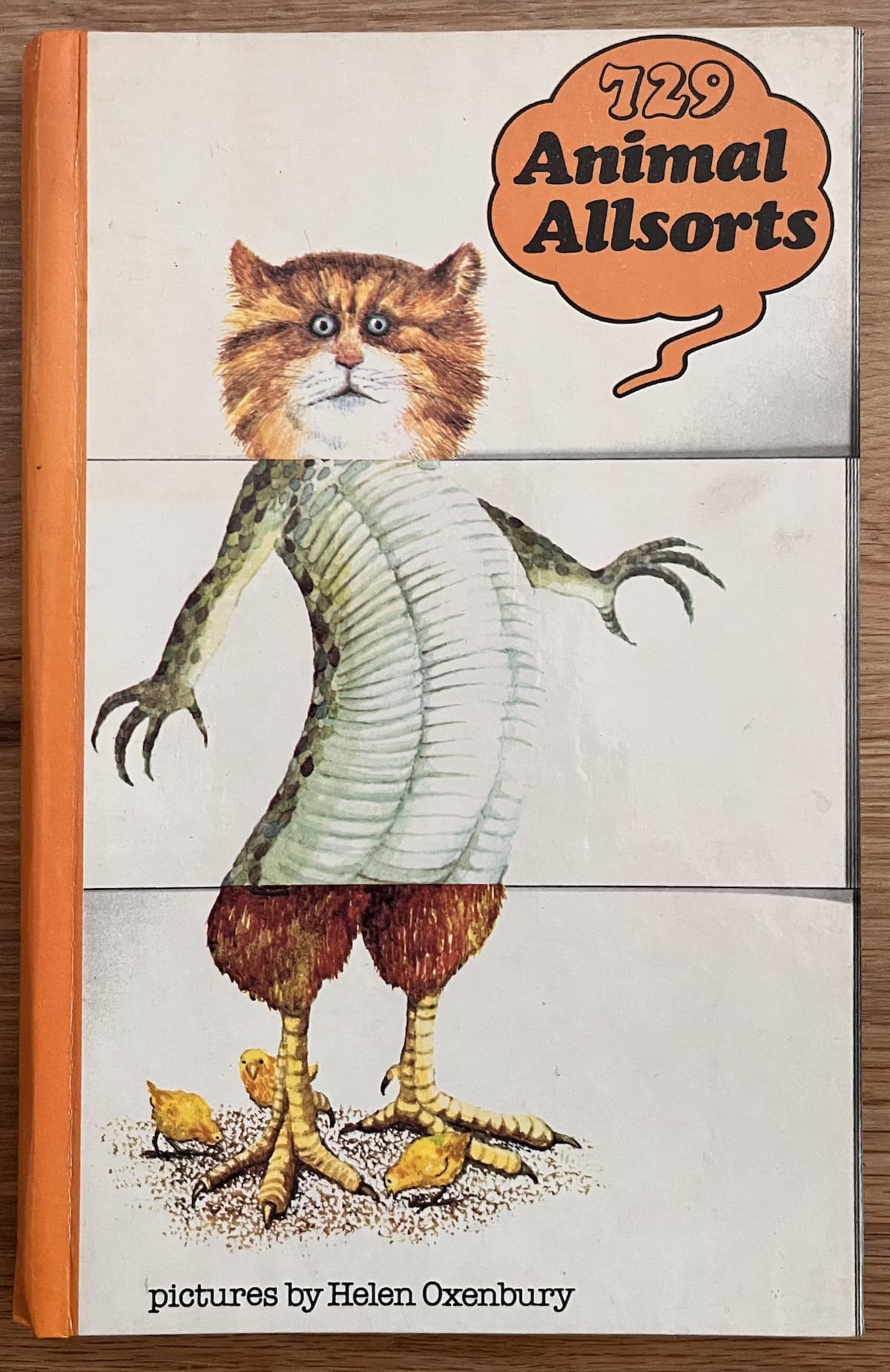The front cover of the Animal Allsorts book, with a 'tomcizaster' shown - cat head, lizard body, rooster feet.