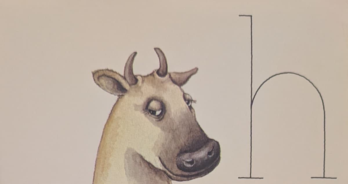 The head of a cow, or heifer. She has somewhat unsettling come-hither eyes.